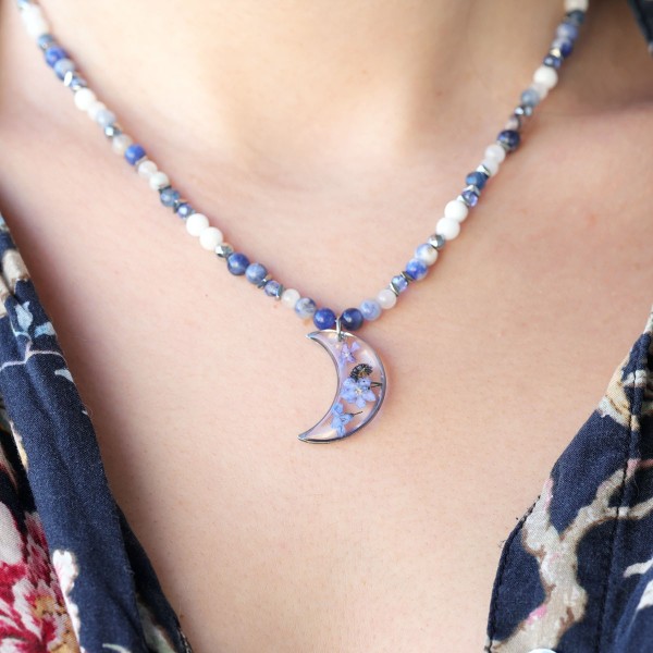 Moon necklace full of stones with forget-me-nots
