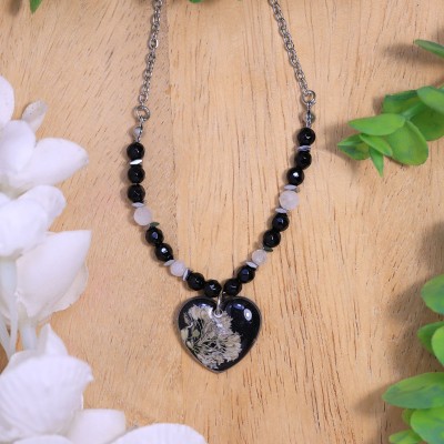 Heart necklace with a wildflower