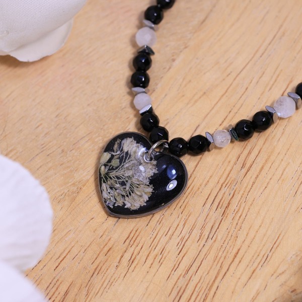 Heart necklace with a wildflower