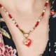 Necklace with a heart pendant and a spirea flower
