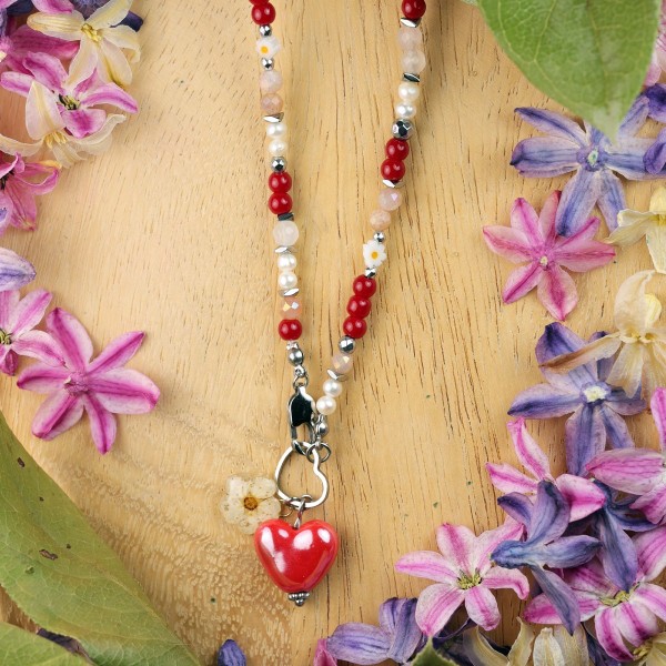 Necklace with a heart pendant and a spirea flower