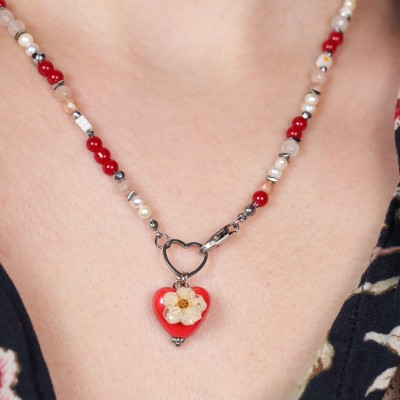 Necklace with a heart pendant and a spirea flower