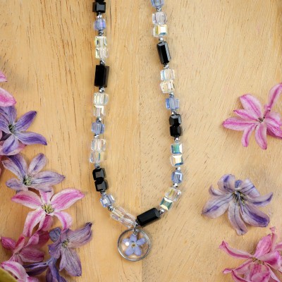 Necklace full of stones with forget-me-not