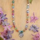 Necklace full of stones with forget-me-not