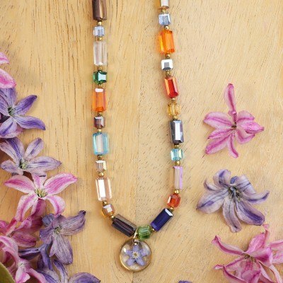 Necklace full of stones with forget-me-not