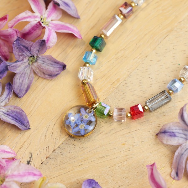 Necklace full of stones with forget-me-not