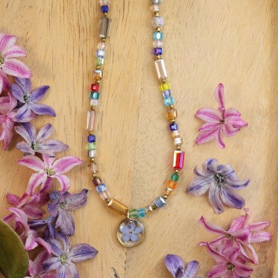 Necklace full of stones with forget-me-not