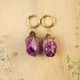 Earrings with embedded rose buds