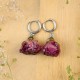 Earrings with embedded rose buds